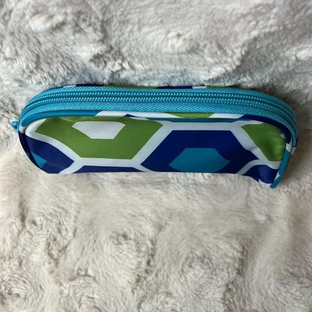 Small cosmetic bag with zip top closure.